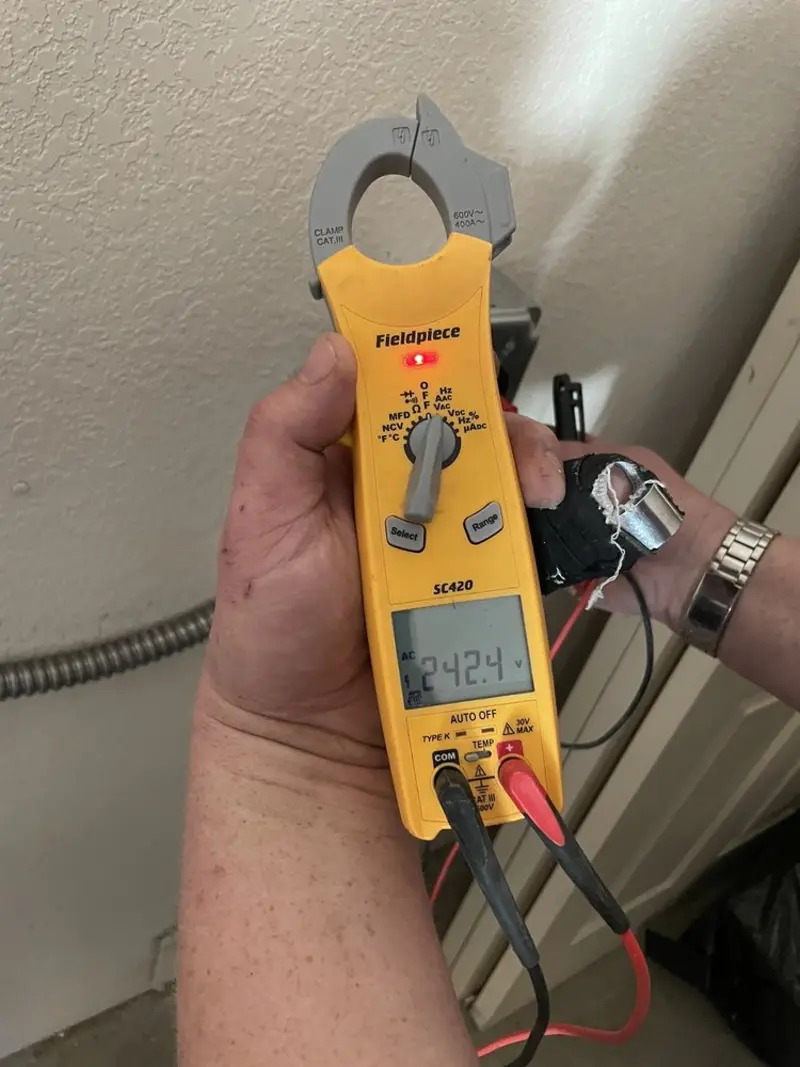 Voltage testing with clamp meter during Electrical Installation Services in Voorhees